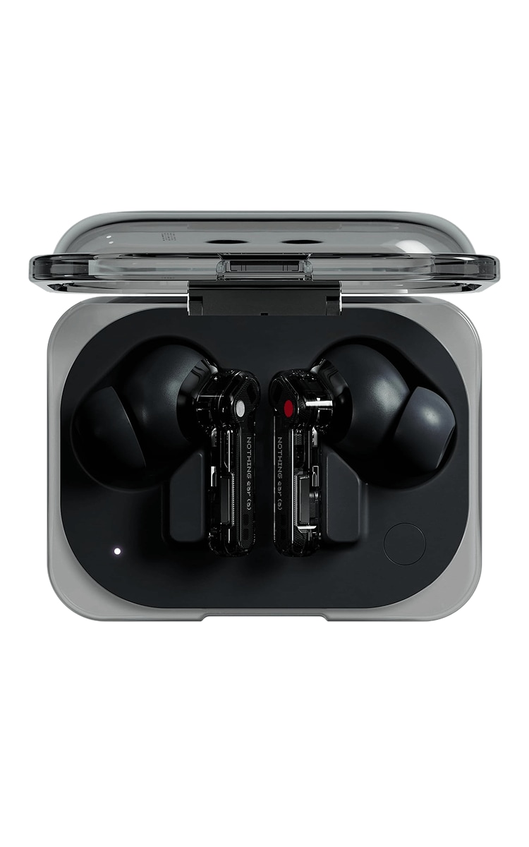 A pair of Nothing Ear (a) black wireless earbuds inside their transparent charging case. The lid of the case is open. The earbuds have a sleek, modern design with black ear tips and transparent stems that feature red accents and a red dot. The case is clear and rectangular, with the "NOTHING" logo visible on the top, and the earbuds are neatly placed inside, showing their distinctive design.