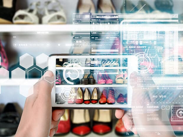 iPhone that shows virtual reality interface of shoe shopping