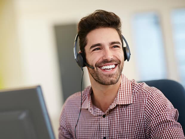 Happy male with a headset on smiling