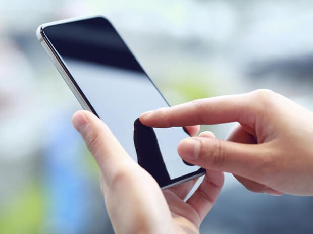 Individual on a iphone scrolling