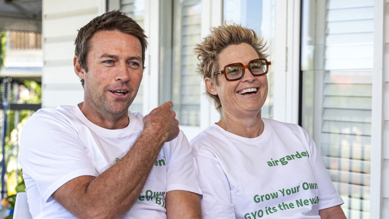 Two men smiling and wearing white tshirts with the AirGarden logo.