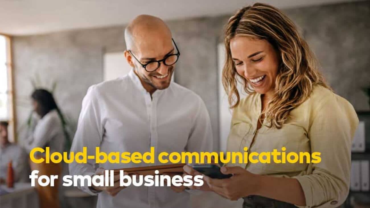 Young business people discuss cloud based communications for small business while in the office.
