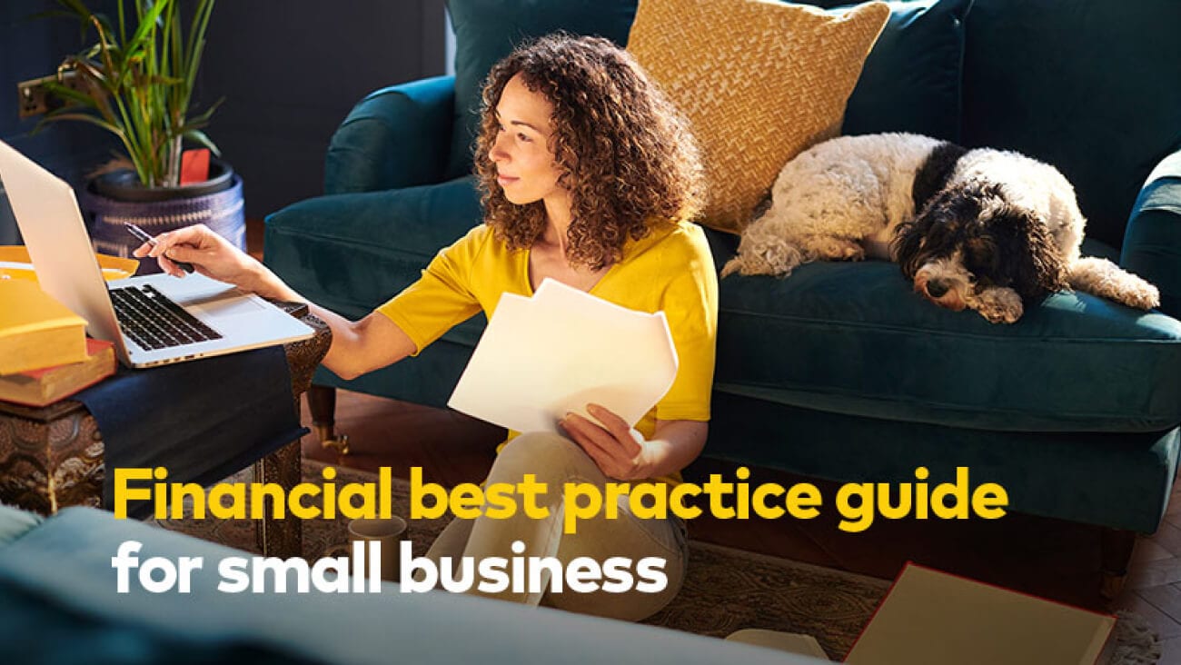 Woman reading financial best practice guide for small business