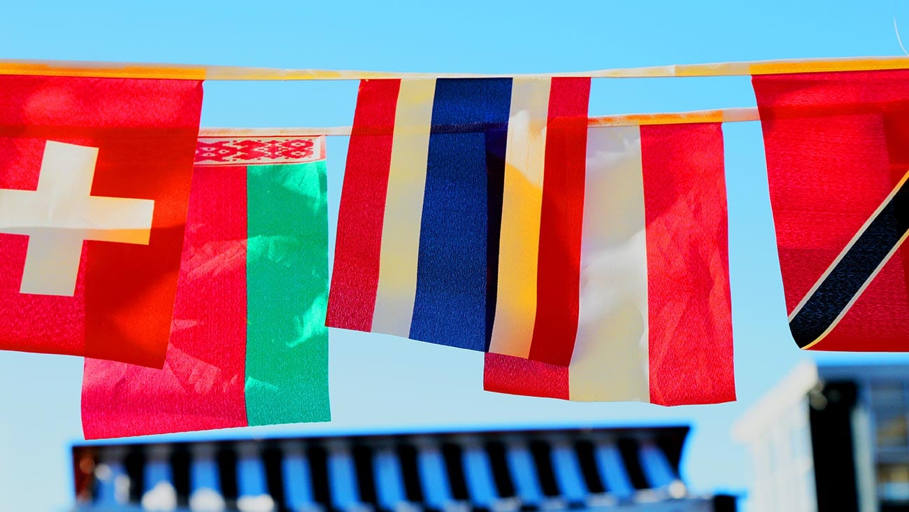 national flags of several nations flying side by side