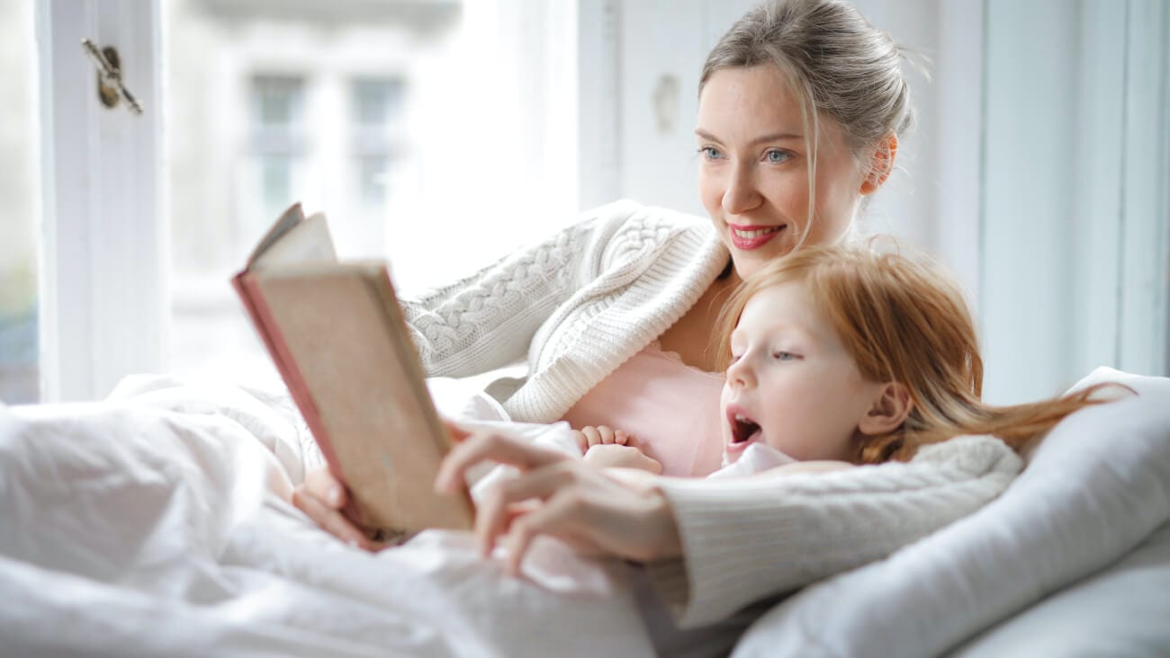 mum and daughter reading a book