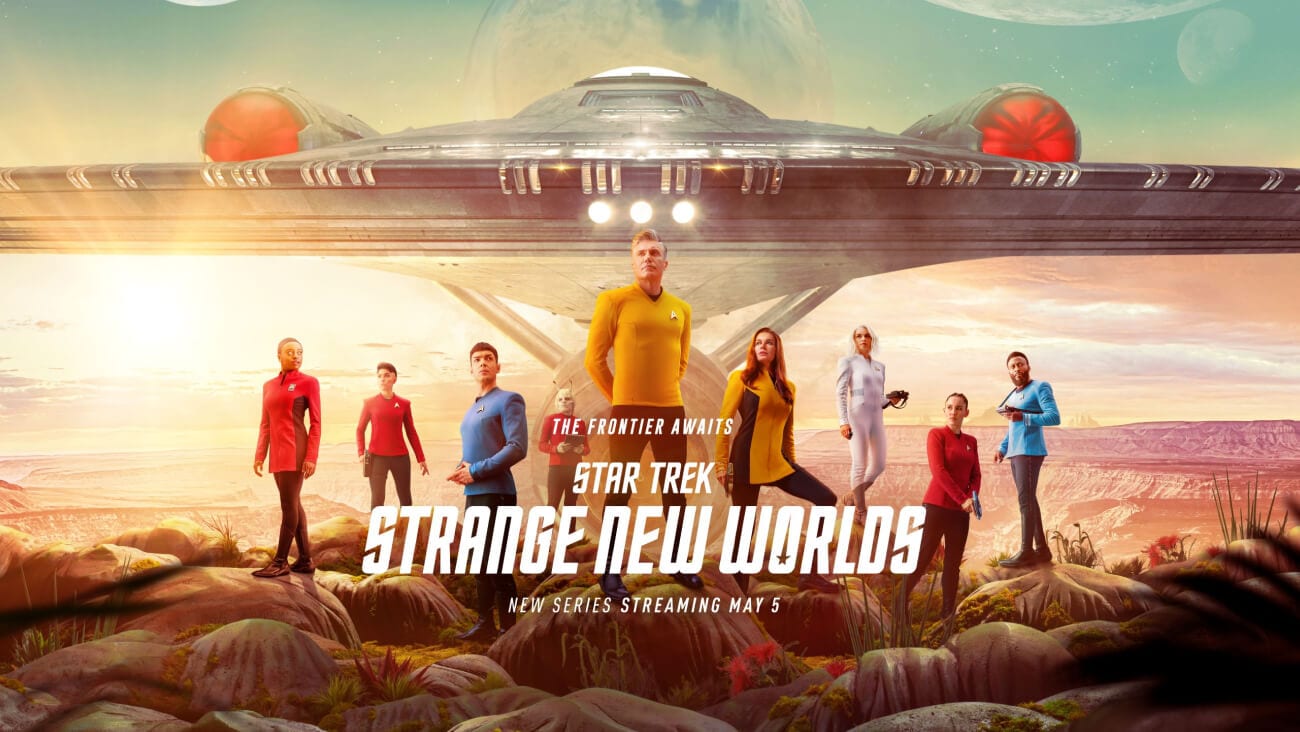 Star Trek: Strange New World poster showing nine adults standing in front of a spaceship