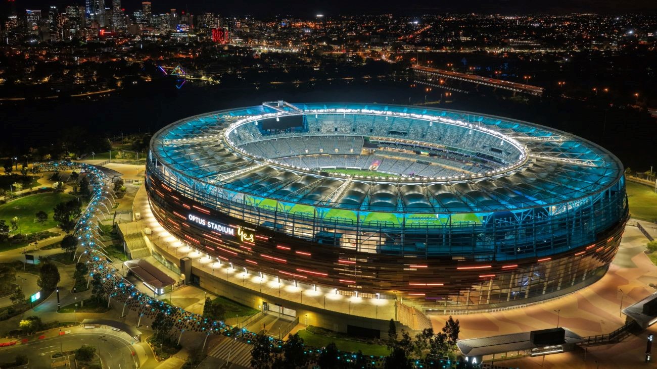 A football stadium lit up at night