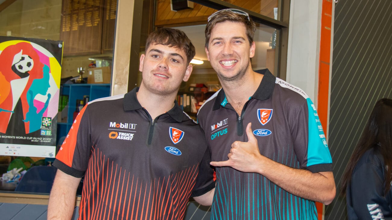 Supercars driver and Optus ambassador Chaz Mostert with a student from Balga Senior High School