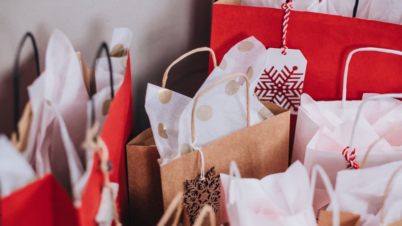 A collection of Christmas gift bags and tissue paper