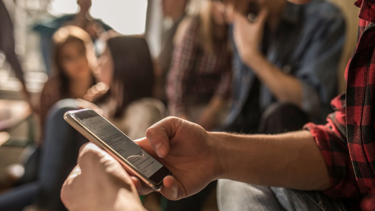 Person scrolling through their phone