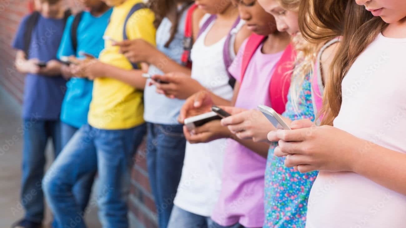 Group of children using their smartphones