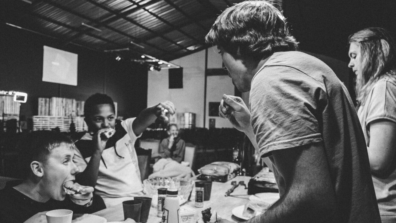 Family members having sitting at the dinner table and eating