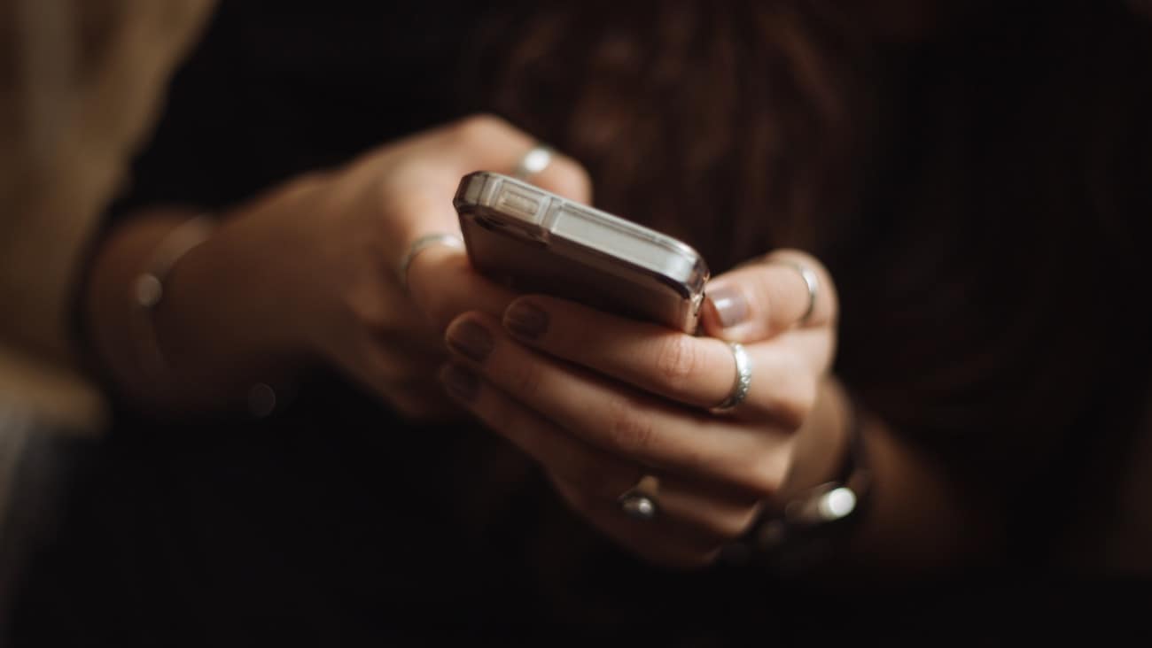 Hands using a smartphone