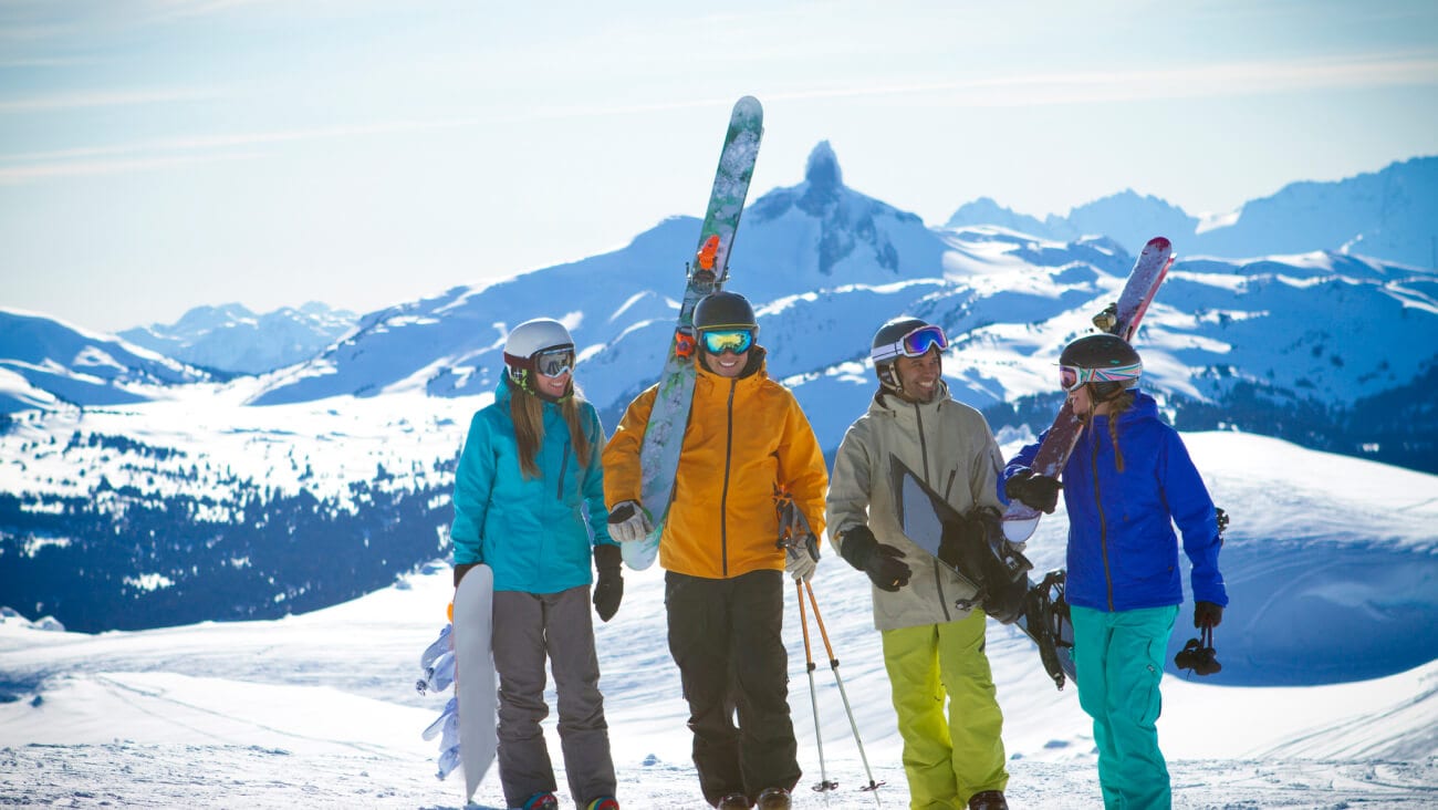 Beautiful sunny day in Whistler Blackcomb ski resort with skiers and snowboarder enjoying snow