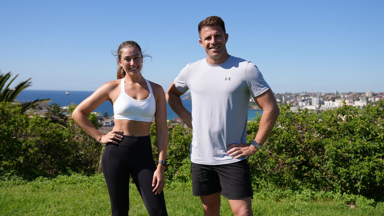 Nutritionist Nicolette Casarotto and Health & Fitness leader Todd Liubinskas stand together on a hilltop