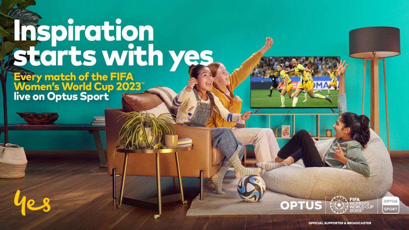 girls watching women's football and cheering