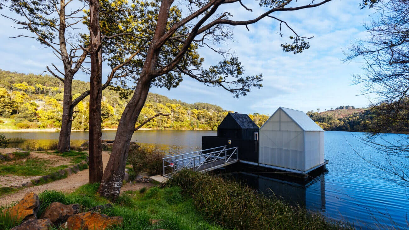 View of a lake with two boat sheds in Derby Tasmania
