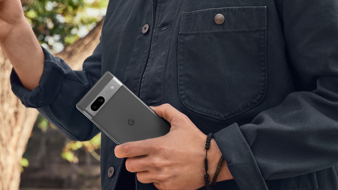 A person holding the new Google Pixel 7a in their left hand