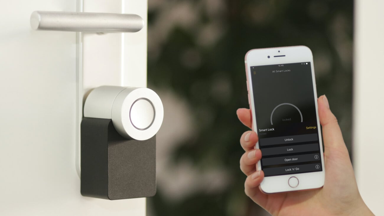 Holding up a phone to unlock a door with a smart lock