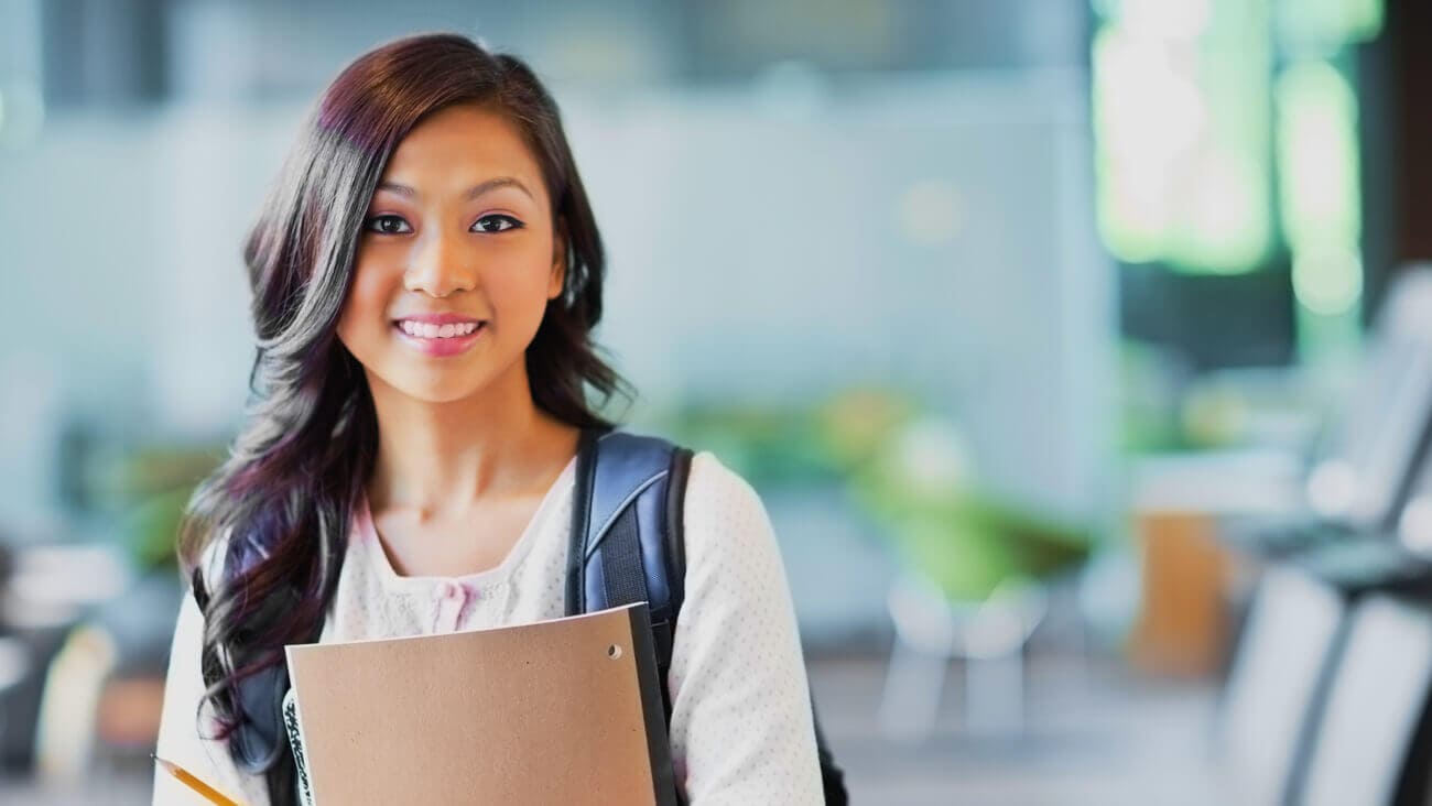 smiling young woman starting university