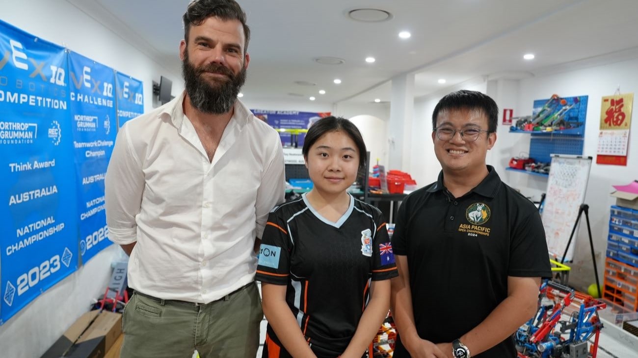 Nicholas Gibson of Optus, Team captain Mia Chen of team Phoenix Tech and Founder and Head Coach of Creator Academy, Garry Law
