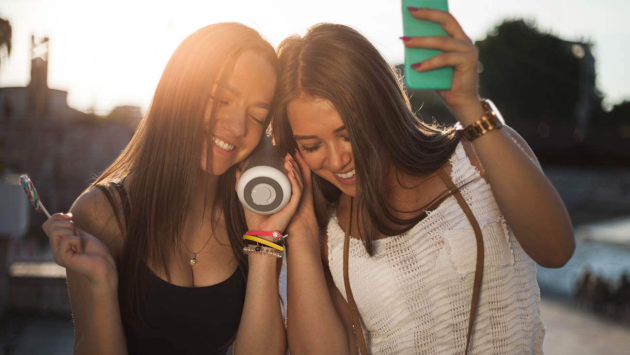 Person rocking out with portable speaker