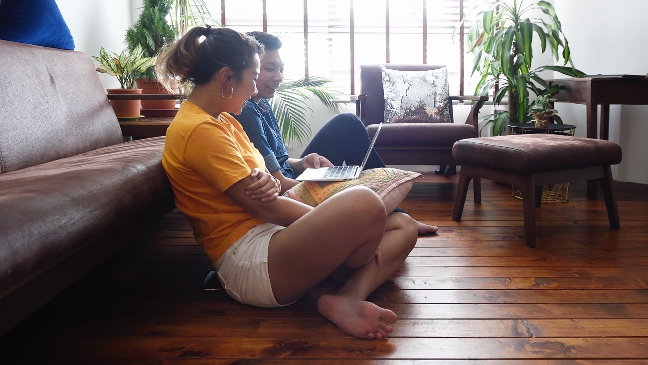 Woman and man looking at laptop