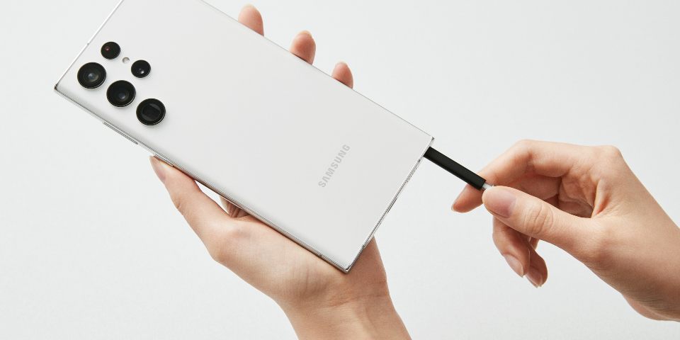 Galaxy S22 Ultra in white showing the embedded S Pen.