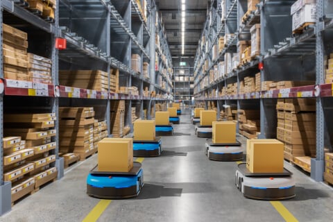 warehouse with robot box transporters