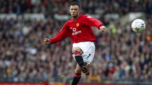 David Beckham of Manchester United takes a trademark free kick during the FA Barclaycard Premiership in 2002.