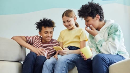 Kids having fun on their mobile devices.