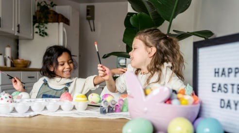 Two kids playing with Easter eggs