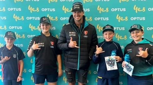 Chaz Mostert with St Thomas More's Catholic School Students