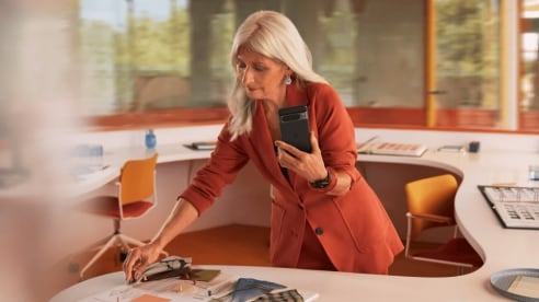 woman using the Google Pixel 8 Pro at work