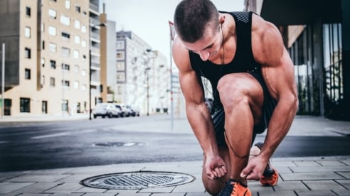 Man tying his shoelace