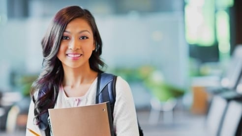 smiling young woman starting university smiling young woman starting university